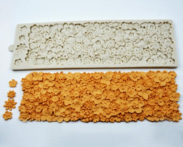 Flowers. Large 37 x 12 cm silicone floral border mold with many flowers.